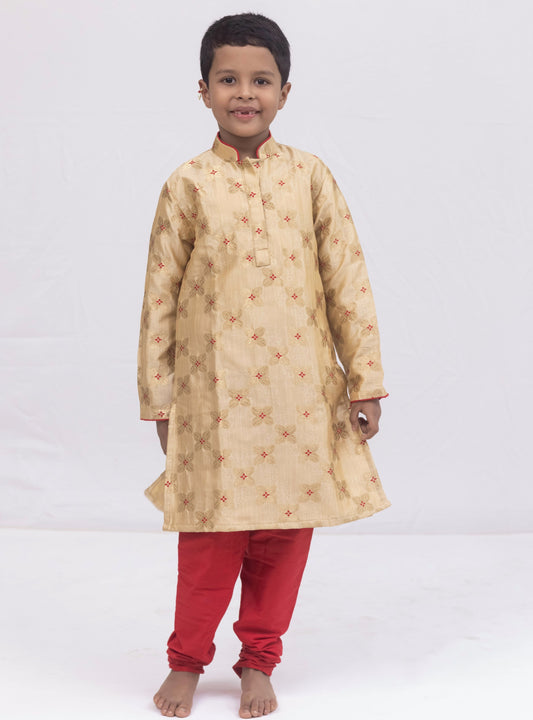 Beige banarasi brocade kurta set with a highlighted stand collar and front placket and red cotton silk chunidar salwar for Boys.Kurtas with collar or Angrakha pattern teamed with salwar are the best choice for any festive occasion for boys. They are Trendy, Easy to wear and comfortable to carry.