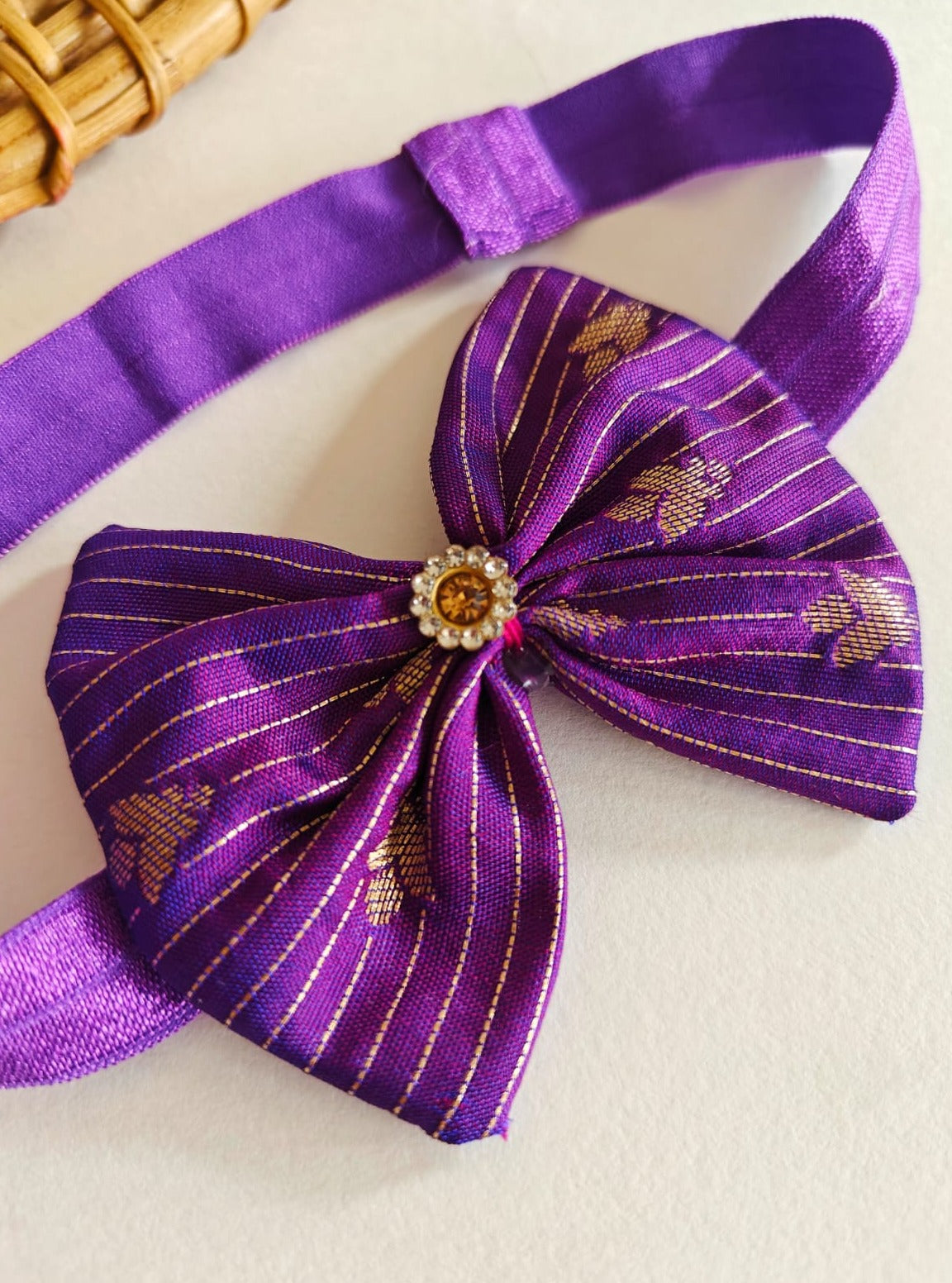 Purple Brocade fabric Bow with stone embellishment, Elasticated headband for a Newborn Baby girl.