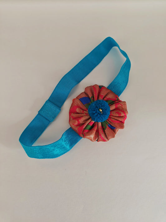 Teal blue paithani fabric flower elasticated headband for baby girl.