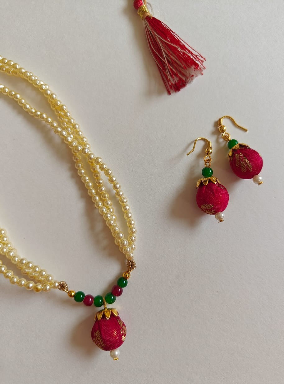 Crimson brocade fabric pendant and triple layered pearls necklace in combination with crimson and green glass beads for Girls