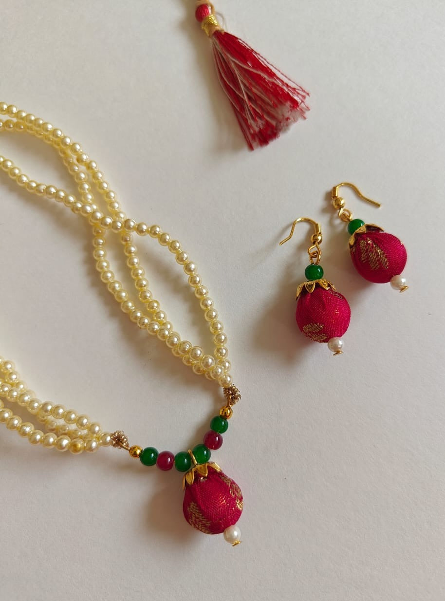 Crimson brocade fabric pendant and triple layered pearls necklace in combination with crimson and green glass beads for Girls