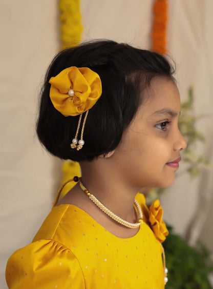 Yellow taffeta dress with elbow length puff sleeves for Girl.Let your princess be as comfortable as in her casuals with carefully designed & crafted Comfort Ethnic Wear by Soyara Ethnics.Keep her fashion quotient high with timeless patterns, vibrant combinations and royal textiles.