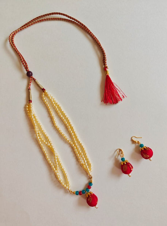 Red brocade fabric pendant and triple layered pearls necklace in combination with red and teal blue glass beads for Girls