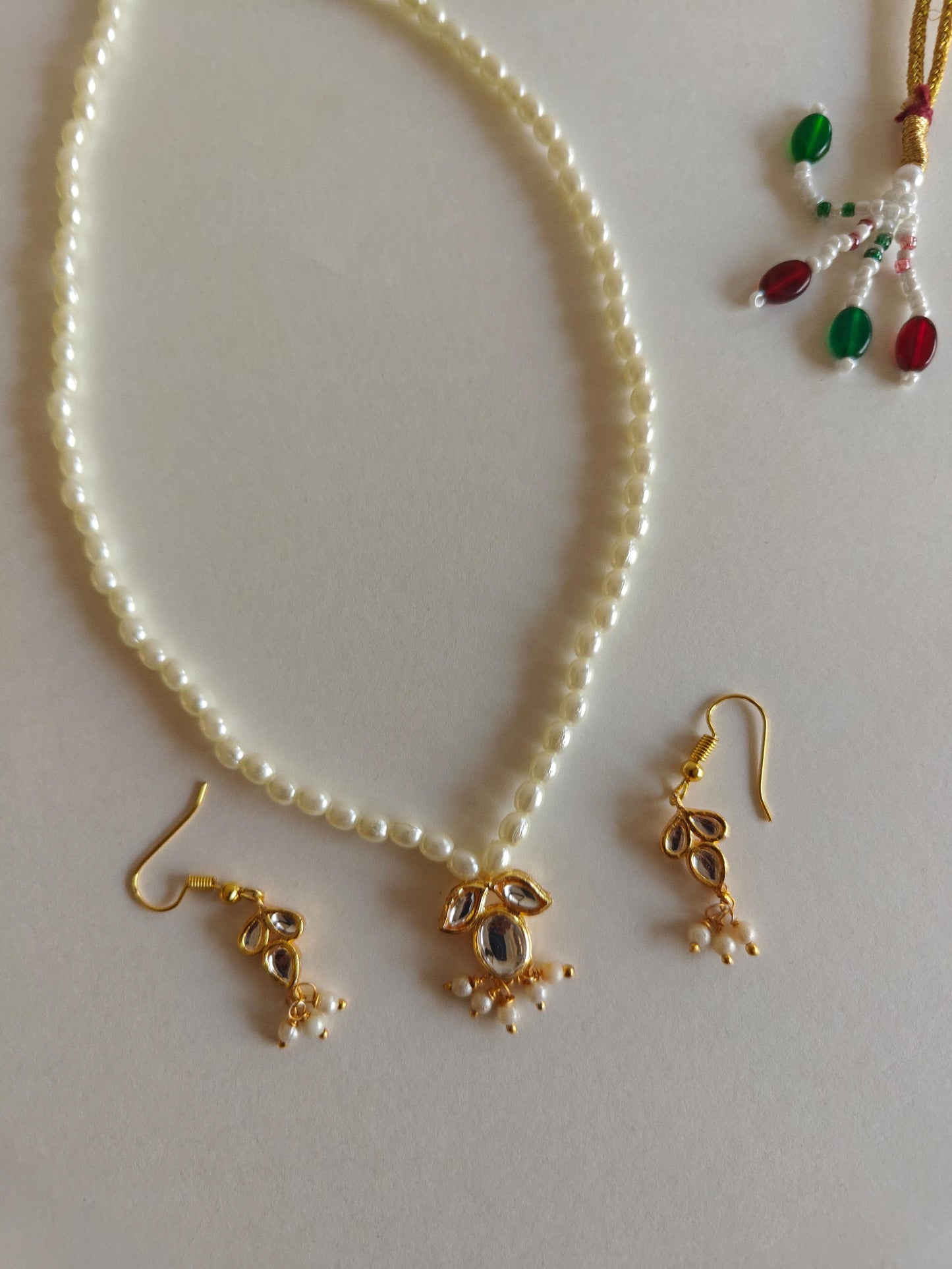 Mukta Set - Pearl chain necklace with Kundan pendant stringed pearls necklace with leaf shaped kundan studded pendant and matching earrings for Girls