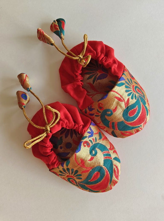 red Peacock Paithani Motif, adjustable unisex Newborn Baby Mojaris /Booties.Paithani motif unisex booties for baby. Team these with any ethnic dress and complete the royal look! Completely made out of fabrics inside out , make these booties perfectly comfy first ethnic wear for the newborn.