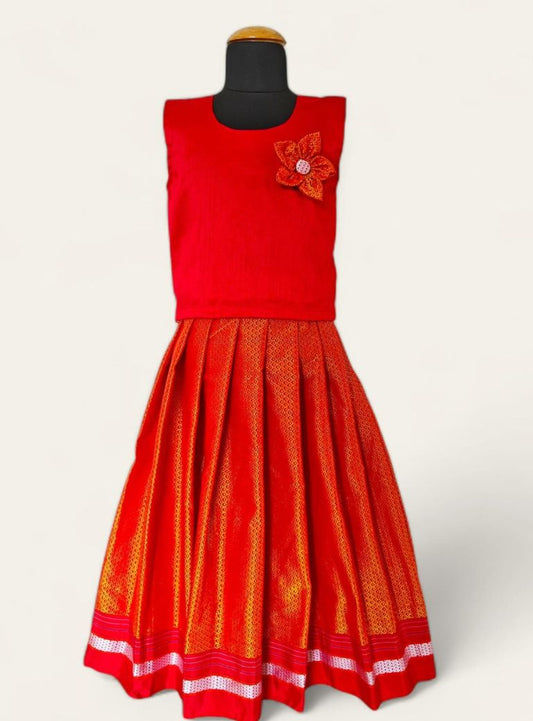 Saffron handloom khunn parkar with red border and red raw silk sleeveless blouse with handcrafted flower motif Girls