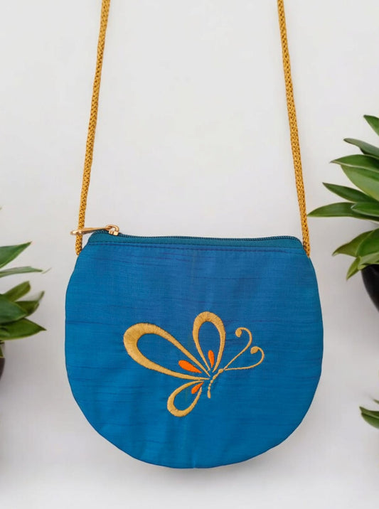 'Butterfly purse' a cute U shaped palm sized purse with a machine embroidered motif and&nbsp;Golden sling belt.  Perfect accessory for any traditional outfit.&nbsp; &nbsp; &nbsp; &nbsp; &nbsp; &nbsp; &nbsp; &nbsp; &nbsp; &nbsp; &nbsp; &nbsp; &nbsp; &nbsp; &nbsp; &nbsp; &nbsp; &nbsp; &nbsp; &nbsp; &nbsp; &nbsp; &nbsp; &nbsp;&nbsp;  Best to keep Mask and Hand Sanitizer. &nbsp; &nbsp;&nbsp; 