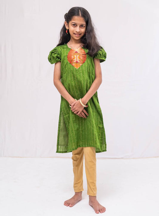 Olive green satin chanderi sequined, puff sleeved kurti with paithani yoke pattern for Girls.Let your princess be as comfortable as in her casuals with carefully designed & crafted Comfort Ethnic Wear by Soyara Ethnics.Keep her fashion quotient high with timeless patterns, vibrant combinations and royal textiles.