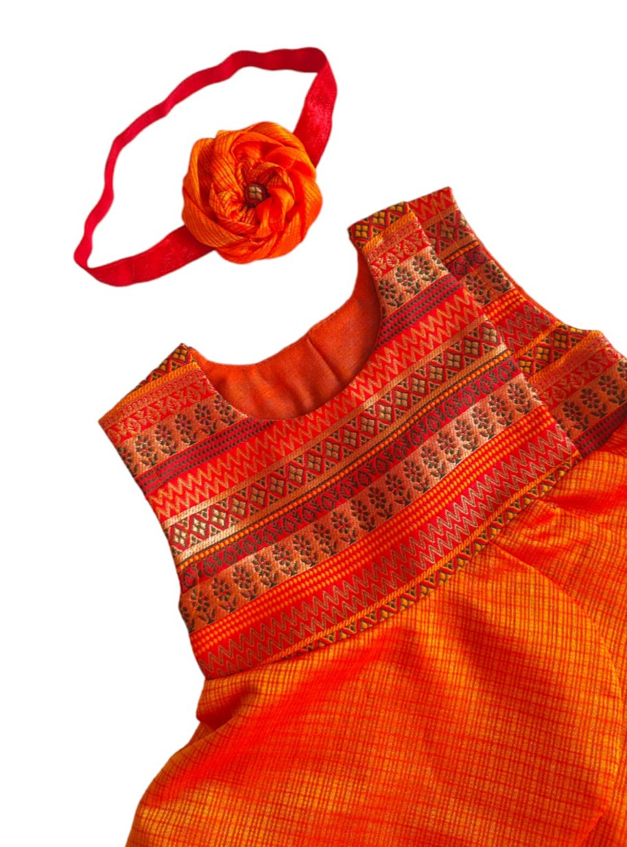 Saffron soft brocade front open layered dress with coordinated bloomer,headband,booties for a newborn baby girl.It's the perfect outfit for your baby's naming ceremony,naamkaran or annaprashan ceremony.Traditional dress for Noolukettu Ceremony,Pachavi Puja,cradle ceremony,Rice Ceremony,Chatti Puja etc. Apt gifting idea