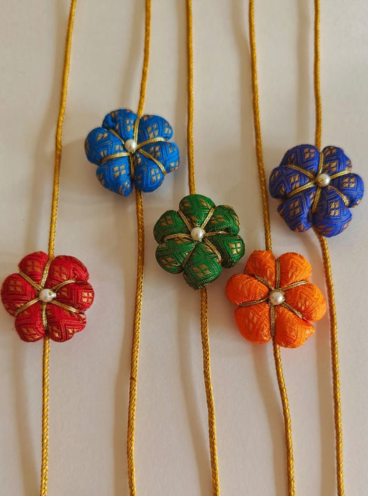 Set of 5 Fabric flower rakhis with golden cord
