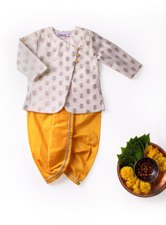 Off white pure chanderi front open kurta teamed with yellow cotton silk dhoti  Newborn Baby Boy.It's the perfect outfit for your baby's naming ceremony,naamkaran,annaprashan ceremony.Traditional dress for Noolukettu Ceremony,Pachavi Puja,cradle ceremony,Rice Ceremony,Chatti Puja etc. Apt gifting idea.