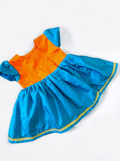 Orange brocade & teal blue silk front open dress for new born Baby Girl provides max comfort. It's the perfect outfit for your baby's naming ceremony , naamkaran or annaprashan ceremony. Traditional and ethnic dress for Noolukettu Ceremony, Paachvi Puja, Cradle ceremony,Rice Ceremony,Chatti Puja etc. Apt gifting idea.