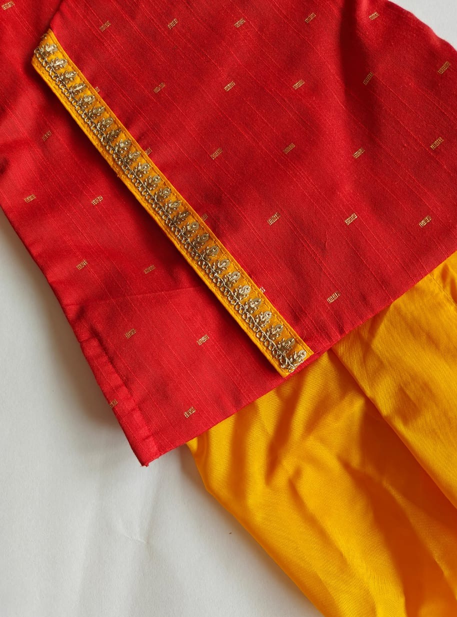 Bright red pine silk kurta with contrast yellow mysore silk dhoti for Baby Boy.It's the perfect outfit for your baby's naming ceremony,naamkaran,annaprashan ceremony.Traditional dress for Noolukettu Ceremony,Pachavi Puja,cradle ceremony,Rice Ceremony,Chatti Puja etc. Apt gifting idea.