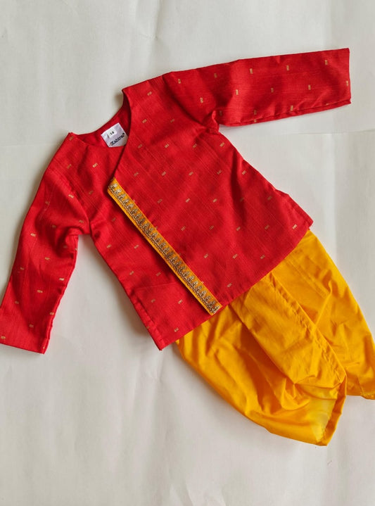 Bright red pine silk kurta with contrast yellow mysore silk dhoti for Baby Boy.It's the perfect outfit for your baby's naming ceremony,naamkaran,annaprashan ceremony.Traditional dress for Noolukettu Ceremony,Pachavi Puja,cradle ceremony,Rice Ceremony,Chatti Puja etc. Apt gifting idea.
