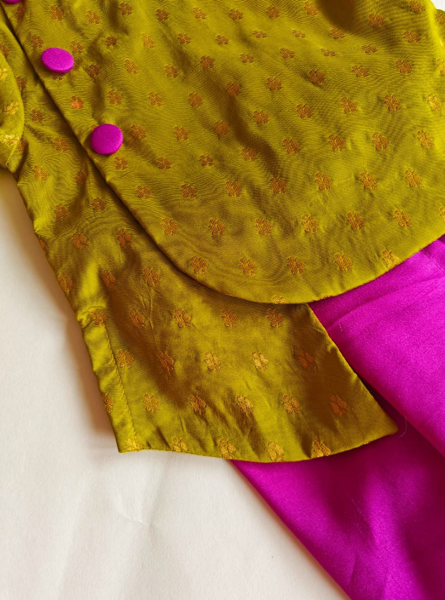 Olive Green brocade silk kurta with magenta fabric buttons teamed with magenta Italian silk dhoti for Baby Boy.It's the perfect outfit for your baby's naming ceremony,naamkaran,annaprashan ceremony.Traditional dress for Noolukettu Ceremony,Pachavi Puja,cradle ceremony,Rice Ceremony,Chatti Puja etc. Apt gifting idea.