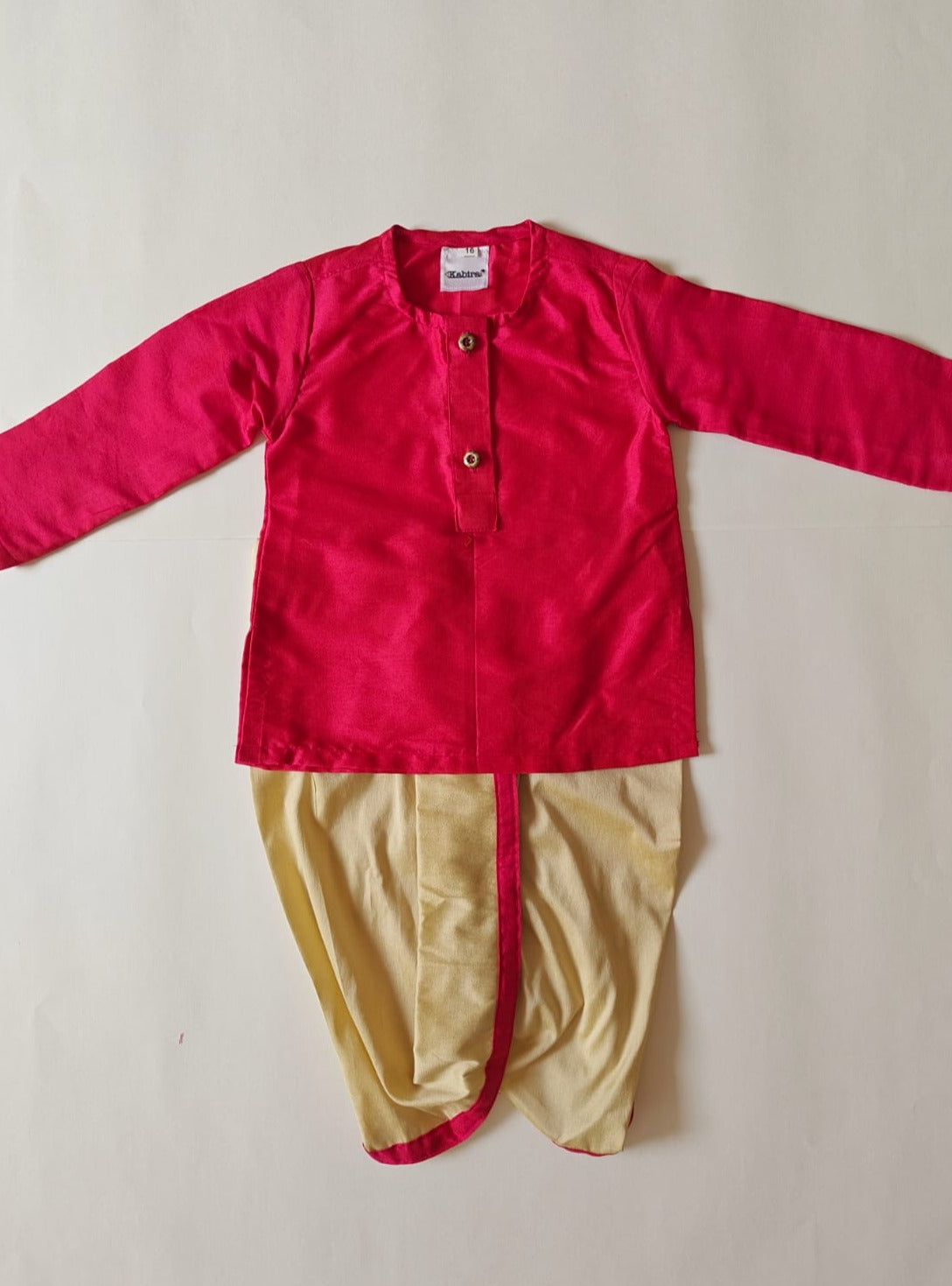 Rani pink cotton silk round neck kurta, Golden cotton silk dhoti with Tussar silk Jacket for Baby Boy.It's the perfect outfit for your baby's naming ceremony,naamkaran,annaprashan ceremony.Traditional dress for Noolukettu Ceremony,Pachavi Puja,cradle ceremony,Rice Ceremony,Chatti Puja etc. Apt gifting idea