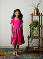 Fuchsia pink brocade taffeta silk frock with intricate Paithani border for girls.Let your princess be as comfortable as in her casuals with carefully designed & crafted Comfort Ethnic Wear by Soyara Ethnics.Keep her fashion quotient high with timeless patterns, vibrant combinations and royal textiles.