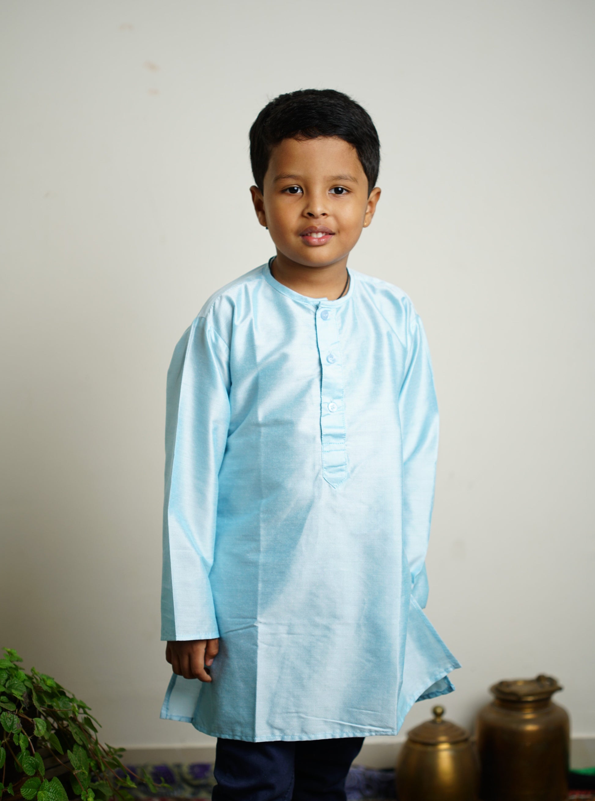 Light Sky Blue cotton silk Round neck long kurta with wooden buttons.Kurtas with collar or Angarakha pattern teamed with salwar are the best choice for any festive occasion for boys.They are Trendy, Easy to wear and comfortable to carry.