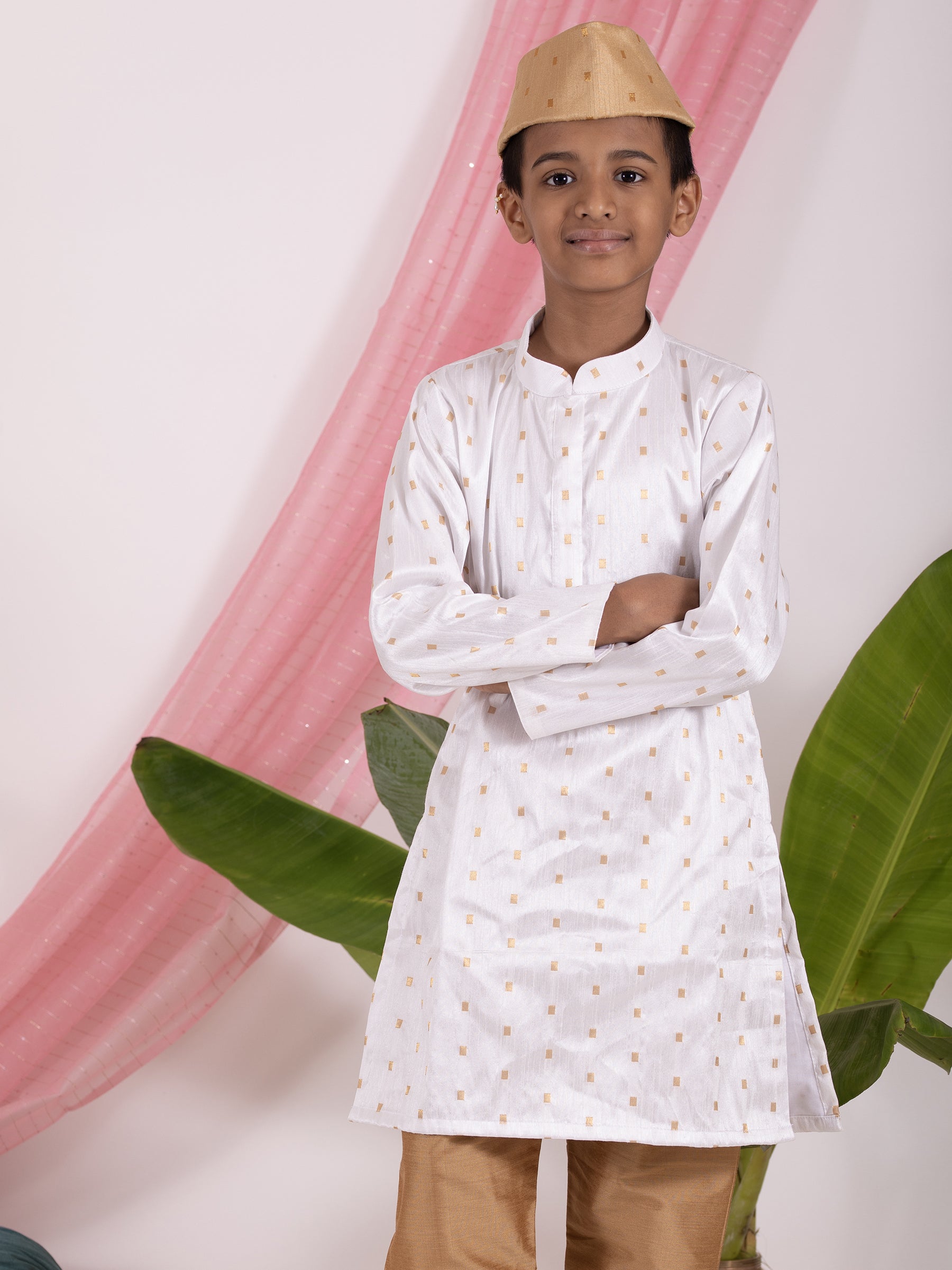 White Bhagalpur Silk Stand Collar Kurta with Golden Salwar Set.Kurtas with collar or Angrakha pattern teamed with salwar are the best choice for any festive occasion for boys.They are Trendy, Easy to wear and comfortable to carry.